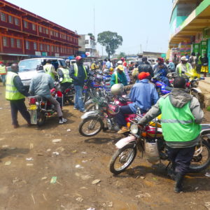 Gathering in front of a M-Pesa shop in Nairobi: Finance in Africa is largely informal. (c) Christian v. Hiller