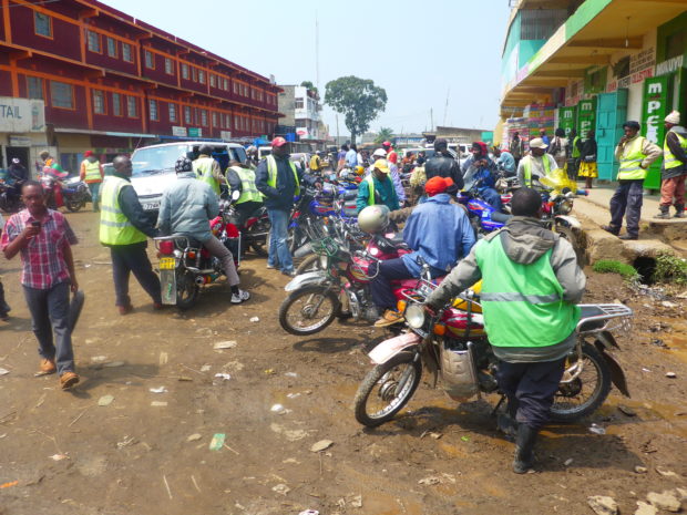 Gathering in front of a M-Pesa shop in Nairobi: Finance in Africa is largely informal. (c) Christian v. Hiller